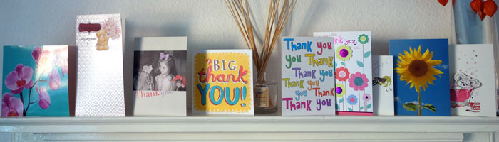 A selection of thank you cards on a mantlepiece